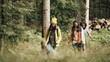 © Flamingo Images - Friends hiking through the woods