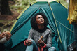 © Flamingo Images - Women having a meal while camping