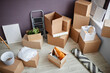 © Seventyfour - Numbers of cardboard containers with things on the floor in new apartment
