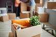 © Seventyfour - Close-up of domestic things packing in cardboard container for relocation