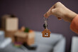 © Seventyfour - Close-up of young woman holding keys in her hand, she getting them from new apartment