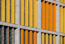 Architectural Background Of A Building Wall With Orange And Yellow Decorative Elements
