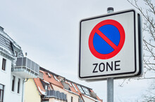 NO PARKING Sign On City Street, Closeup