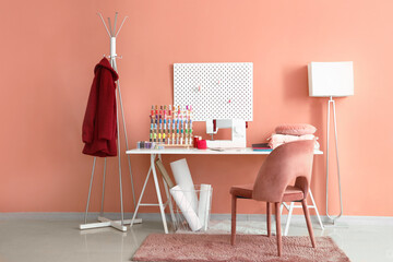 Poster - Interior of atelier with tailor's workplace, thread spools and pegboard