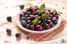 Bowl Of Delicious Plums On The Tablecloth. Summer Harvest. Summer Background