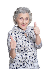 Poster - portrait of senior woman, posing against white background