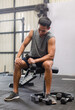© Bangkok Click Studio - Asian young muscular fit strong body sporty athletic male fitness model in workout sleeveless sportswear holding lifting metal dumbbell weight training arms exercise at CrossFit gym
