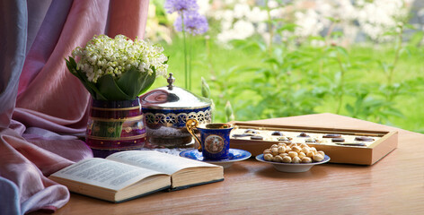 Wall Mural - Still life with a bouquet and an old book