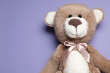 Cute Teddy Bear On Light Purple Background, Top View. Space For Text