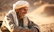 Portrait of a laughing Bedouin man in the desert. Created with Generative AI technology.