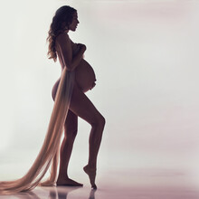 Woman, Pregnant And Fabric With Silhouette In Studio With Hands, Touch And Healthy By White Background. Pregnancy Model, Shadow Art Or Wellness Mockup With Cloth, Body And Stomach With Dark Aesthetic