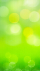 green blur nature image with bright light bokeh texture as vertical blurred story background with co