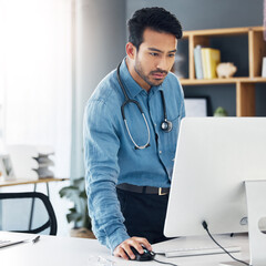 Wall Mural - Serious, man doctor and computer research, healthcare innovation and planning online. Medical worker, desktop technology and reading data of test results, wellness management and telehealth database