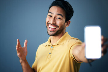 Poster - Phone mockup, studio portrait and happy man with online ui for product placement, branding copy space or marketing. Advertising mock up, white screen cellphone and excited person on blue background