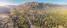 Ormana Village Aerial View. Majestic Mountain Ridge Covered With Lush Forest