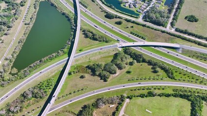 Poster - View from above of busy american highway bridge with fast moving traffic in green Florida area. Interstate transportation concept