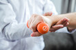 © joyfotoliakid - Physiotherapist man giving exercise with dumbbell treatment About Arm and Shoulder of athlete male patient Physical therapy concept