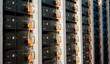 © malp - Image of a battery energy storage system consisting of several lithium battery modules placed side by side. This system is used to store renewable energy and then use it when needed. 3d rendering.