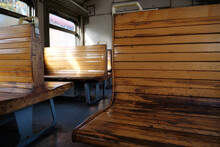 Old Empty Wagon Of Train. Wooden Seats In An Empty Coach Of Train