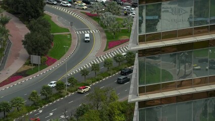 Wall Mural - 4K time lapse traffic video in Dubai. Traffic filmed from above on the highway street boulevard in Dubai city center during rush hour traffic. United Arab Emirates, 2023.