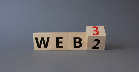 Web 3 vs Web 2 symbol. Turned wooden cubes with words web 2 vs web 3. Beautiful grey background. Business concept. Copy space