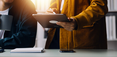 Close up ux developer and ui designer use augmented reality brainstorming about mobile app interface wireframe design on desk at modern office.Creative digital development agency