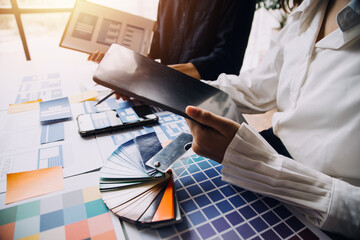 Close up ux developer and ui designer use augmented reality brainstorming about mobile app interface wireframe design on desk at modern office.Creative digital development agency