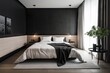 A minimalist bedroom with a bed and a geometric accent wall, featuring a monochrome color palette and minimal decor.