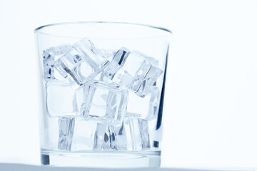 Poster - glass with ice cubes closeup