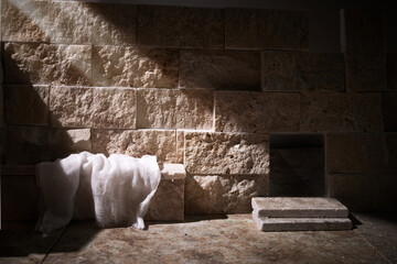 Empty tomb while light shines from the outside. Jesus Christ Resurrection. Christian Easter concept.