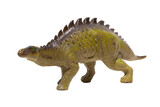 Close up of a plastic dinosaur toy with spikes on its back isolated on white background.