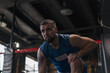 © Guys Who Shoot - Male boxer training fit man doing boxing in gym young man doing warm up stretching muscles