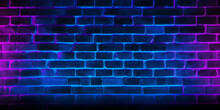 Neon Light On Brick Walls That Are Not Plastered Background And Texture. Lighting Effect Red And Blue Neon Background Vertical Of Empty Brick Basement Wall.