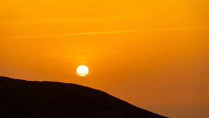 Wall Mural - Beautiful and dramatic sunset colours over the volcanic mountain range near Corralejo in Fuerteventura Canary Islands Spain