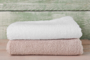 Wall Mural - Folded soft towels on wooden table