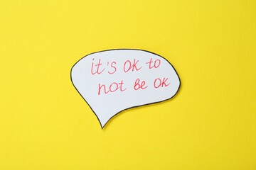 Wall Mural - Card with phrase It`s Ok to Not Be Ok on yellow background, top view