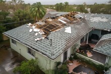 Hurricane Ian Destroyed House Roof In Florida Residential Area. Natural Disaster And Its Consequences. Generative AI