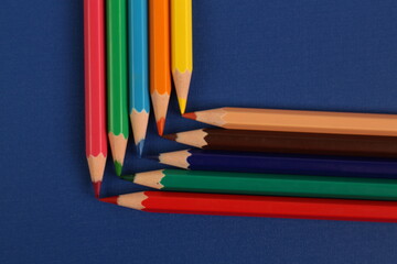 Colored Pencils on Blue Background