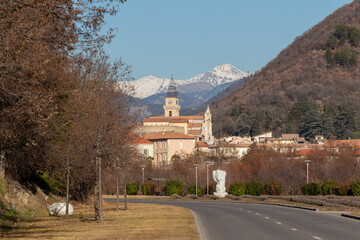 Panorama of Digne les Bains, Alpes de Haute Provence, France, with the tower of the  Cathédrale Saint-Jérôme (Saint Jerome cathedral) and the snowy Alps Mountains in the background.