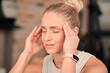 © Phindulo T/peopleimages.com - Woman, headache and pain at gym for fitness, exercise anxiety and workout challenge. Face of female athlete with migraine, sports injury and frustrated in struggle of training problem, sick and tired