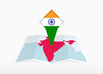 Wall Mural - India is depicted on a folded paper map and pinned location marker with flag of India.