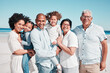 © Clayton D/peopleimages.com - Parents, kids and grandparents in beach portrait on walk, freedom and vacation together with love. Old man, woman and grandchildren by ocean for happiness, wellness and adventure on holiday in summer