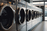 Fototapeta  - line of laundry machine, Industrial washing machines in a public laundromat.

