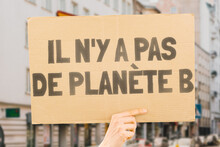 The Phrase " There Is No Planet B " Is Drawn On A Carton Banner In Men's Hands. Climate Change. Protest. Global Warming. Zone. Disaster. Tension. Poison. Toxin. Damage. Impact. Air