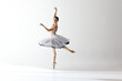 © Lustre Art Group  - Portrait of tender young ballerina dancing, performing over white studio background. Beauty of classical dance