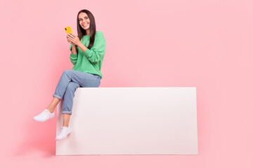 Sticker - Photo of cheerful cute lady wear trendy clothes sitting empty space look interesting news sale discount isolated on pink color background