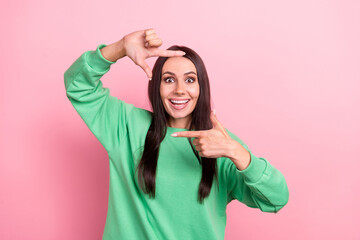 Sticker - Closeup portrait take snapshot excited young lady blogger photographer show fingers image her beautiful face isolated on pink color background