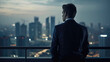 © nenetus - Back view of attractive executive man looking at the city from the moder office balcony. Generative AI