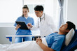 © Nuttapong punna - Doctors explaining the symptoms to a patient in a hospital or therapeutic treat client Professional medical service concept..