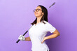 © luismolinero - Young golfer woman over isolated colorful background suffering from backache for having made an effort